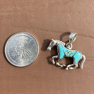 Sterling silver reversible horse pendant
